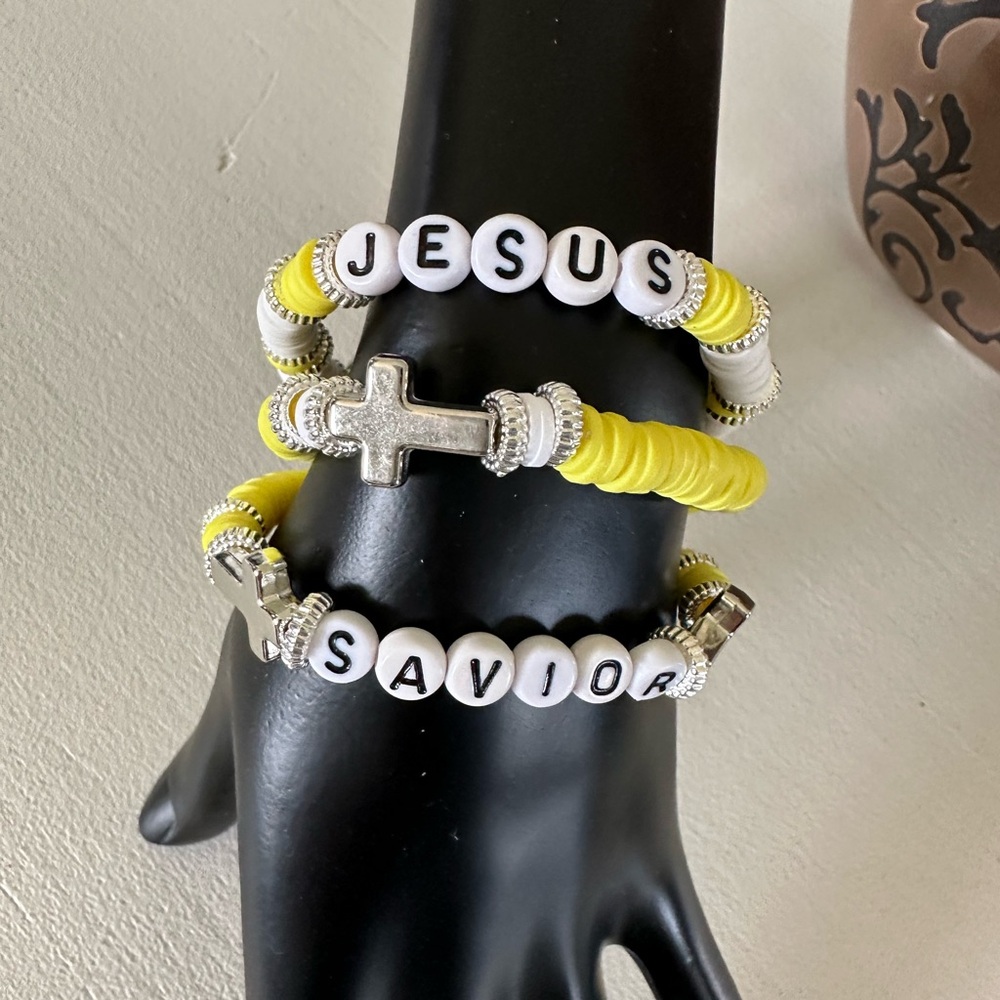 Beautiful homemade clay beaded bracelets with silver accents and cross